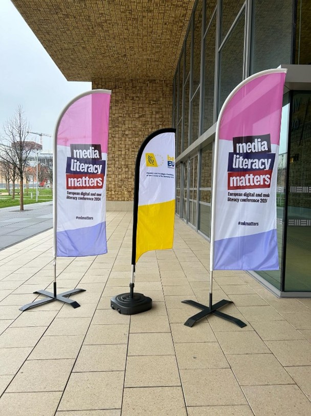 Banners of the Media Literacy Matters conference at the entrance of the venue.