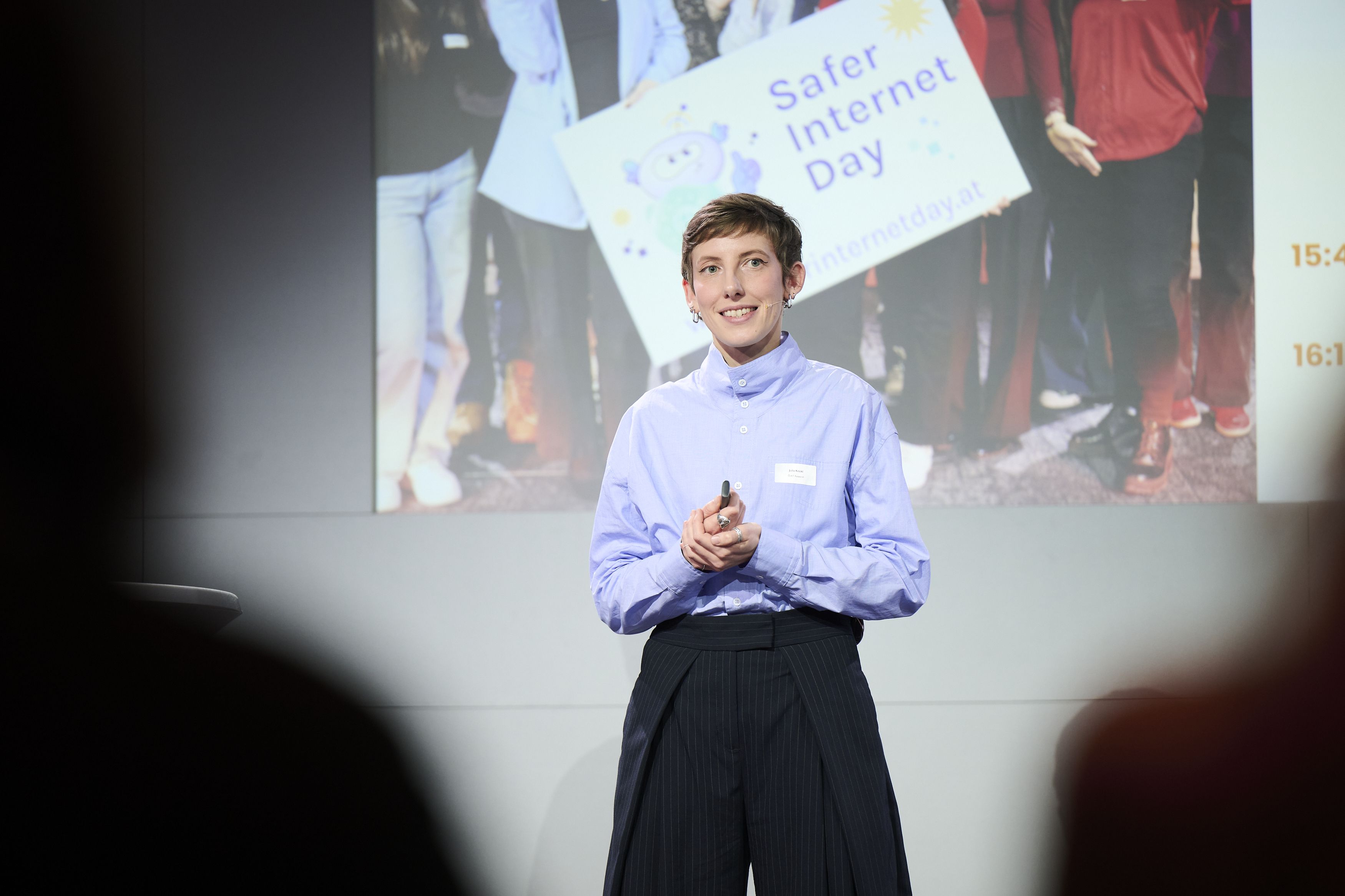 Julia giving her presentation on stage