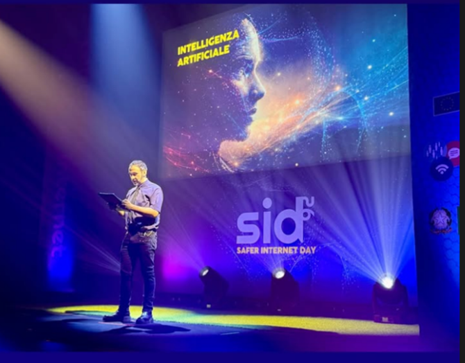 A speaker on stage delivering an inspiring speech