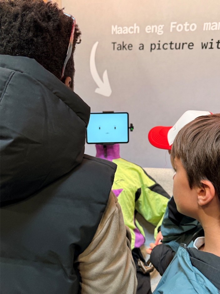 Rene the mascot interacting with participants at an event