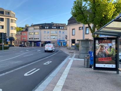 Bus stop with an ad of the campaign