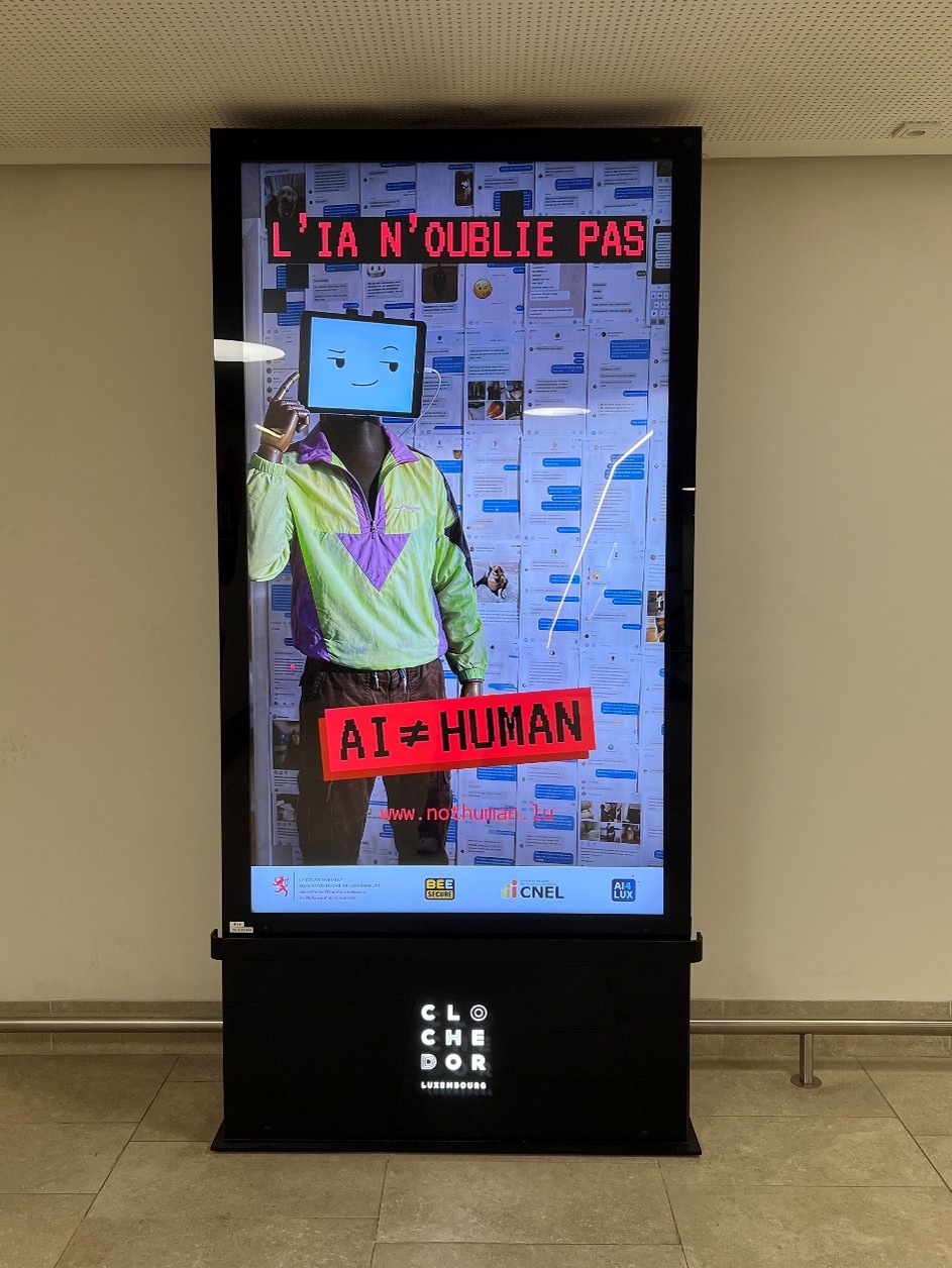 Ad for the campaign on a digital totem in a public place