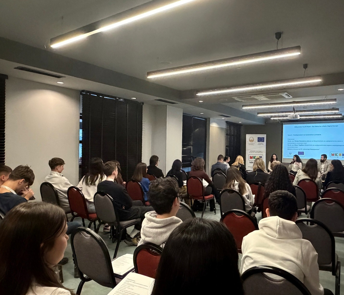 View of partiipants (young people) following a panel on stage