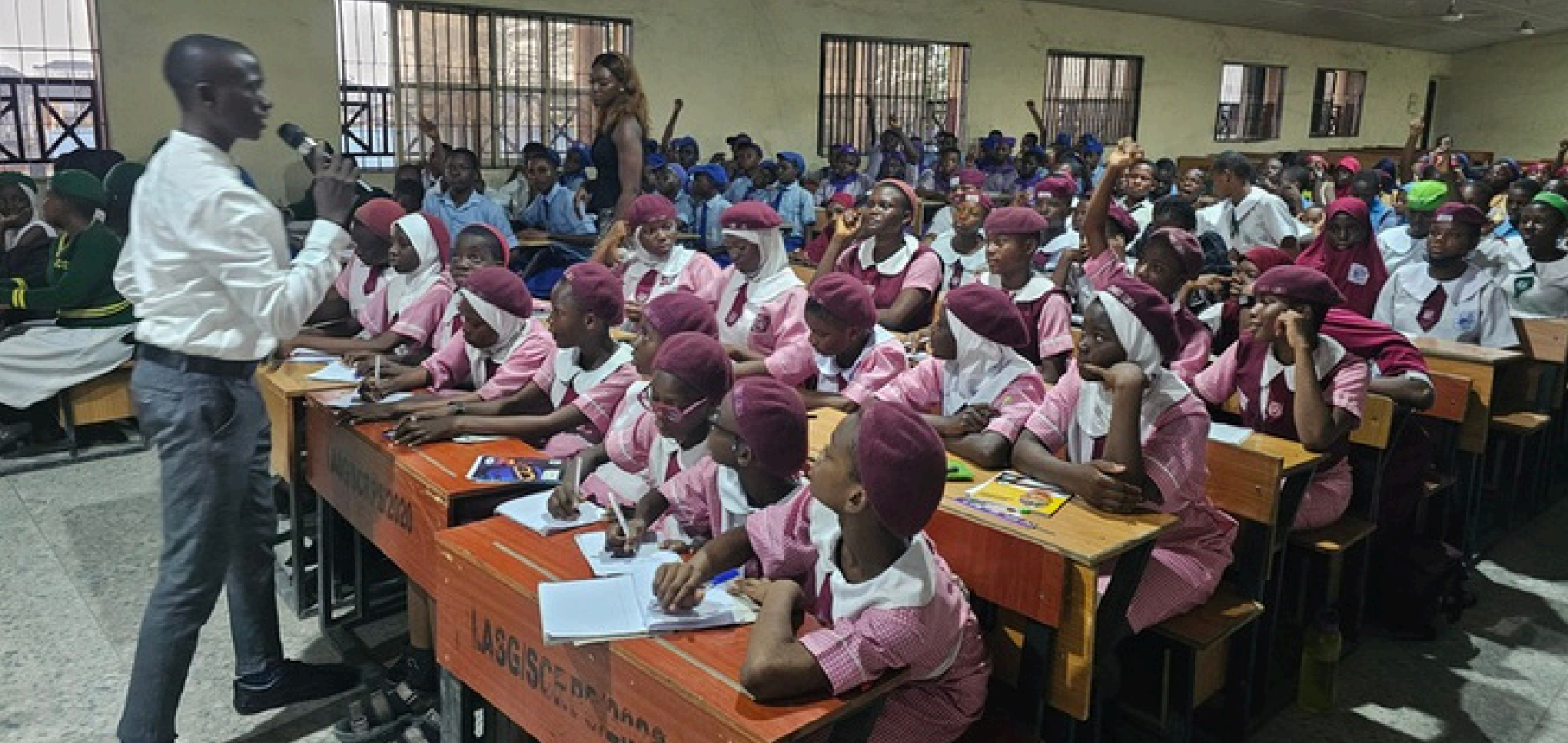 View of the classroom with young girls and boys attending the SID event
