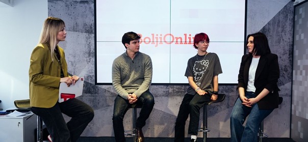 Four panellists including two young people at the event
