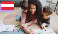 Mom playing coloring a book with her two sons