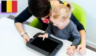 A mother and her toddler daughter playing on a tablet