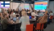 Group of experts from Nordic countries' SICs having a meeting in a large conference room