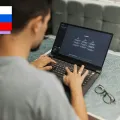 A young student using ChatGPT on a laptop