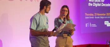 A picture of 2 young people giving a speech on the stage at the SIF 2023