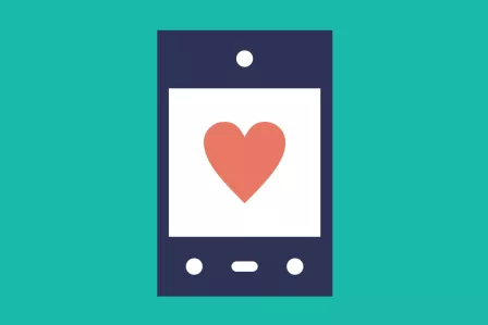 A smartphone with an icon of a heart on it