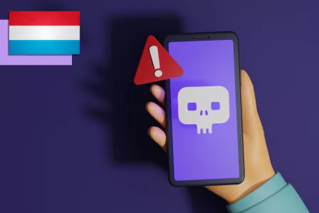 A person holding a phone with a danger sign on the screen.