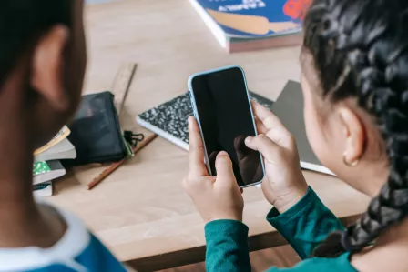 Children using their phones at school