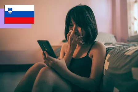 Girl crying while looking at her phone