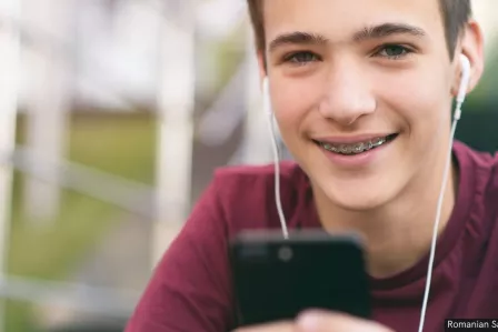 Teenager holding a phone