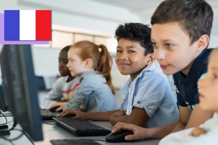 Children using digital tools in a classroom.