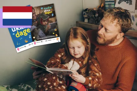 Dad reading with his child