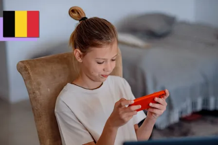 A young girl looking at her phone