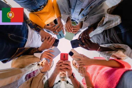 A group of young people standing in a circle, each holding a smartphone