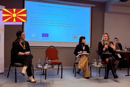 Three young people on stage during a session at the youth panel event in Skopje, North Macedonia