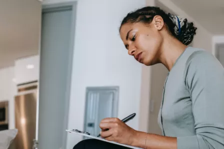 Woman writing on a notebook