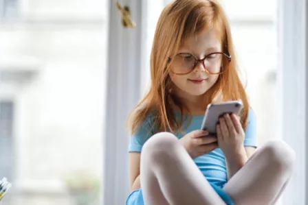 Young girl using a mobile phone
