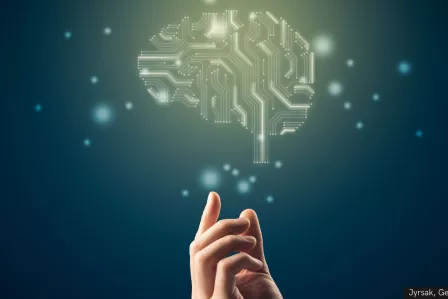 Hand touching an artificial brain