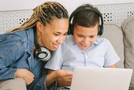 Parent and child using a laptop