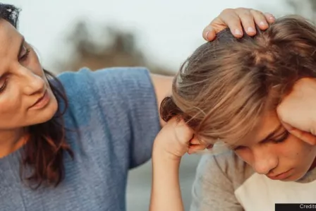 Woman comforting a boy