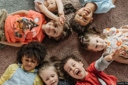 Children lying down on the floor