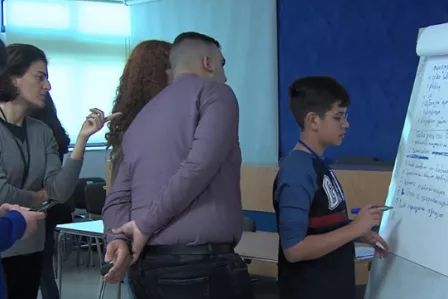 A boy writing on a flipchart at the Cyprus CyberSafety Youth Panel event