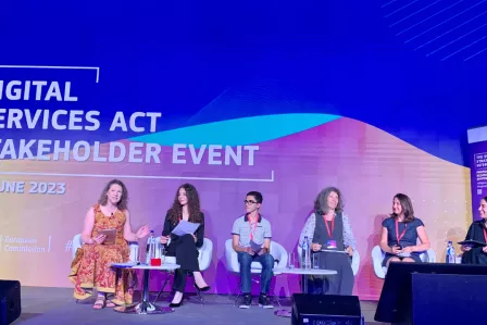 5 speakers of the panel discussionon the stage at the DSA event