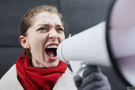 A woman holding a megaphone