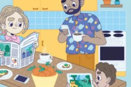 Man woman and child sitting at a table with electronic devices