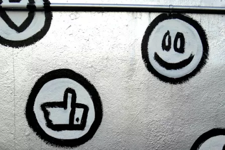 Emoji-style symbols painted on a wall