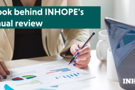 Logo of the INHOPE annual review featuring a person writing on a piece of paper.