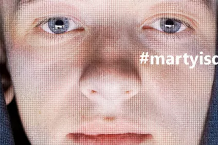 Close-up shot of a teenage boy's face with the tagline #martyisdead