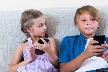 Children looking at their phone