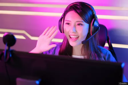 Girl in a streaming setting greeting the camera