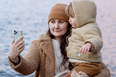 Mother taking a selfie with a young child