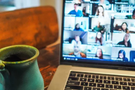 Close up of a laptop screen showing a video call in progress