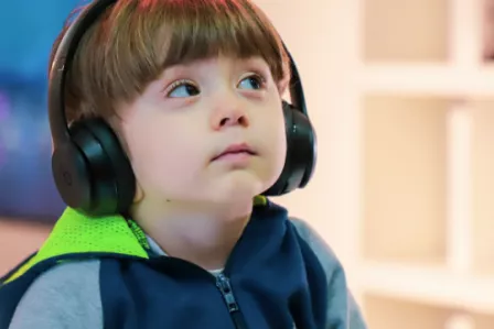 Young child wearing headphones