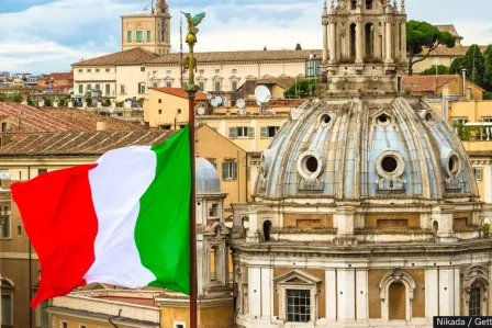 Italian flag with city in background