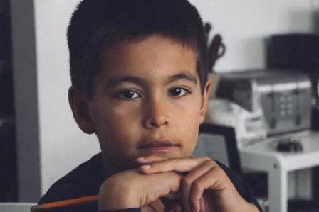 Young boy looking thoughtful