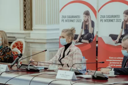 Two women and one man sitting behind a table at a Safer Internet Day event