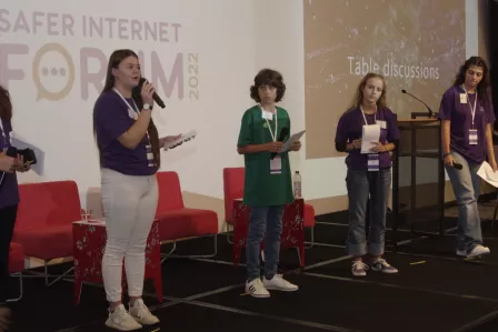 A group of four Safer Internet Forum Youth panellists on the stage