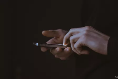 Photo of person holding a smartphone