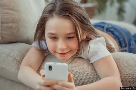 little girl with phone