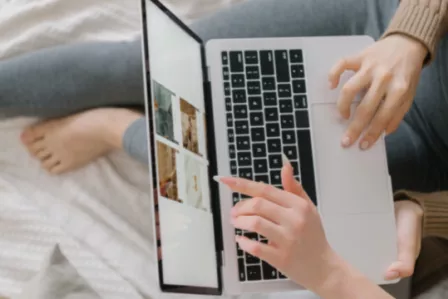 Birdseye view of people browsing on a laptop