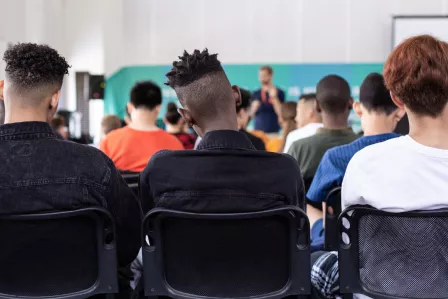 A group of high school students sitting in their classroom